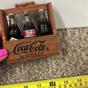 Vintage Coca-Cola bottles and carrier